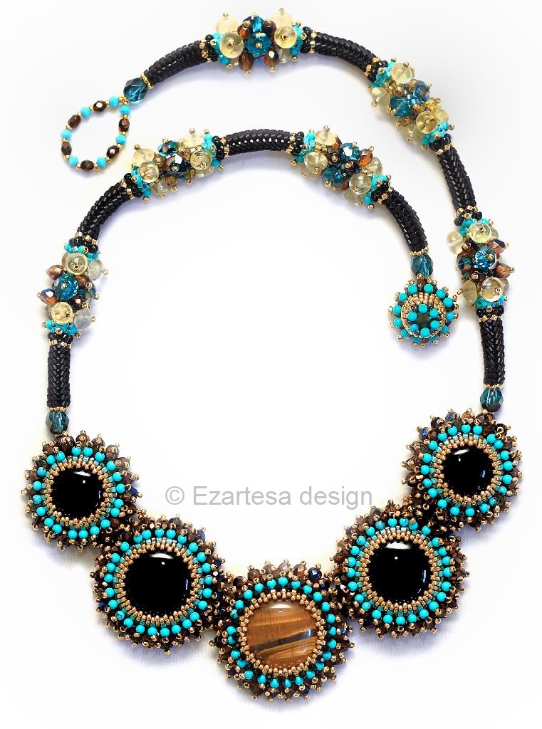 taurus-zodiac-sign-birthstones-jewelry-black-onyx-tiger-eye. This necklace is hand beaded from tiny glass seed beads, Tiger Eye cabochons, Black Onyx cabochons, Czech glass beads, Turquoise beads and Citrine gemstone beads.